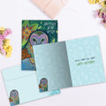 Load image into Gallery viewer, The inside of Tree-Free’s Another Year Wiser card, with the cover and envelope in the background.