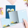 Load image into Gallery viewer, The inside of Tree-Free’s Follow Your Heart card, with the cover and envelope in the background.