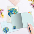 Load image into Gallery viewer, The inside of Tree-Free’s You Mean the World card, with the cover and envelope in the background.