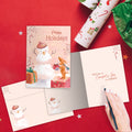 Load image into Gallery viewer, The inside of Tree-Free’s Comfort Joy Snowman card, with the cover and envelope in the background.