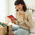 Load image into Gallery viewer, Lifestyle image(s) featuring Tree-Free’s Merry Bright Reindeer card