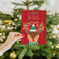 Load image into Gallery viewer, Lifestyle image(s) featuring Tree-Free’s Merry Bright Reindeer card