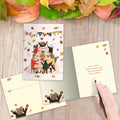 Load image into Gallery viewer, The inside of Tree-Free’s Thankful Feast card, with the cover and envelope in the background.
