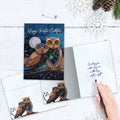 Load image into Gallery viewer, The inside of Tree-Free’s Long Winter Night card, with the cover and envelope in the background.