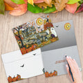 Load image into Gallery viewer, The inside of Tree-Free’s Spooky and Fun card, with the cover and envelope in the background.