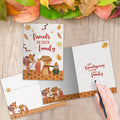 Load image into Gallery viewer, The inside of Tree-Free’s Friends Are Family card, with the cover and envelope in the background.