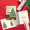 Load image into Gallery viewer, The inside of Tree-Free’s Warmth This Season card, with the cover and envelope in the background.