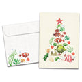 Load image into Gallery viewer, The cover of Tree-Free's Beachy Tree card, along with its matching envelope.