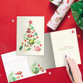 Load image into Gallery viewer, The inside of Tree-Free’s Beachy Tree card, with the cover and envelope in the background.