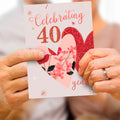 Load image into Gallery viewer, Lifestyle image(s) featuring Tree-Free’s Ruby Celebration card
