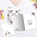 Load image into Gallery viewer, The inside of Tree-Free’s 25 Years of Love card, with the cover and envelope in the background.