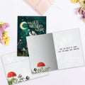 Load image into Gallery viewer, The inside of Tree-Free’s Magical Wishes card, with the cover and envelope in the background.