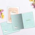 Load image into Gallery viewer, The inside of Tree-Free’s Loved Beyond Measure card, with the cover and envelope in the background.
