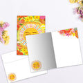 Load image into Gallery viewer, The inside of Tree-Free’s Grateful Sun card, with the cover and envelope in the background.