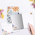 Load image into Gallery viewer, The inside of Tree-Free’s What She Became card, with the cover and envelope in the background.
