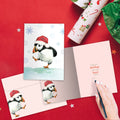 Load image into Gallery viewer, The inside of Tree-Free’s Puffin Dance card, with the cover and envelope in the background.