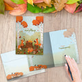 Load image into Gallery viewer, The inside of Tree-Free’s Grateful Foxes card, with the cover and envelope in the background.