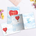 Load image into Gallery viewer, The inside of Tree-Free’s Heart Air Balloon card, with the cover and envelope in the background.