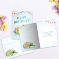 Load image into Gallery viewer, The inside of Tree-Free’s Flower Turtle card, with the cover and envelope in the background.