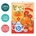 Load image into Gallery viewer, The cover of Tree-Free’s Lucky Tea Set card with lines demonstrating its 5x7 dimensions, along with the following text: “100% PCW recycled paper, proudly made in the USA, sustainably printed on extra-thick card stock”