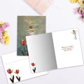 Load image into Gallery viewer, The inside of Tree-Free’s Floating on a Bubble Daughter card, with the cover and envelope in the background.