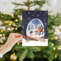 Load image into Gallery viewer, Lifestyle image(s) featuring Tree-Free’s Sweet Snowglobe card