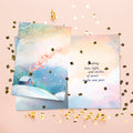 Load image into Gallery viewer, The inside of Tree-Free’s Luminous Love card, with the cover and envelope in the background.