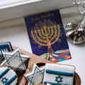 Load image into Gallery viewer, The inside of Tree-Free’s Hanukkah Tree card, with the cover and envelope in the background.