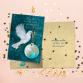 Load image into Gallery viewer, The inside of Tree-Free’s Peace and Hope New Year card, with the cover and envelope in the background.