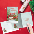 Load image into Gallery viewer, The inside of Tree-Free’s Kringle Tree Farm card, with the cover and envelope in the background.