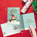 Load image into Gallery viewer, The inside of Tree-Free’s Merry Snowman card, with the cover and envelope in the background.