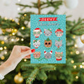 Load image into Gallery viewer, Lifestyle image(s) featuring Tree-Free's Meowy Christmas card