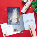 Load image into Gallery viewer, The inside of Tree-Free’s Oh Holy Night card, with the cover and envelope in the background.