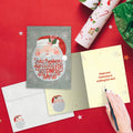 Load image into Gallery viewer, The inside of Tree-Free’s Santa Be Good card, with the cover and envelope in the background.