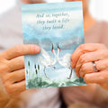 Load image into Gallery viewer, Lifestyle image(s) featuring Tree-Free’s Dancing Cranes card