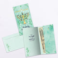Load image into Gallery viewer, The inside of Tree-Free’s Floral Menorah card, with the cover and envelope in the background.