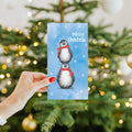 Load image into Gallery viewer, Lifestyle image(s) featuring Tree-Free's Boho Christmas Penguins card