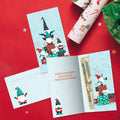 Load image into Gallery viewer, The envelope for Tree-Free’s Gnomes Piled High card, along with the following text: “Every Tree-Free 5x7 card comes with a matching ARTvelope!”