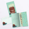 Load image into Gallery viewer, The inside of Tree-Free’s Amazing Cake card, with the cover and envelope in the background.