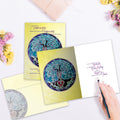 Load image into Gallery viewer, The inside of Tree-Free’s Tree Of Life Blessing card, with the cover and envelope in the background.
