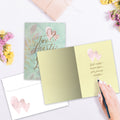 Load image into Gallery viewer, The inside of Tree-Free’s Two Hearts card, with the cover and envelope in the background.