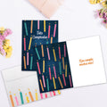 Load image into Gallery viewer, The inside of Tree-Free’s Cumpleanos Candles card, with the cover and envelope in the background.
