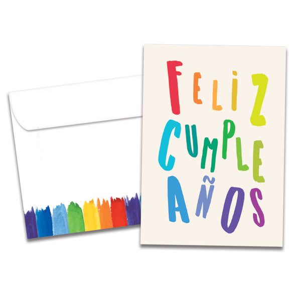 The cover of Tree-Free's Cumpleanos Rainbow card, along with its matching envelope.
