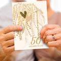 Load image into Gallery viewer, Lifestyle image(s) featuring Tree-Free’s Golden Hearts Tree card

