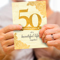 Load image into Gallery viewer, Lifestyle image(s) featuring Tree-Free’s 50 Golden Years card
