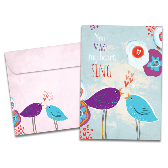 The cover of Tree-Free's Singing Hearts card, along with its matching envelope.