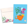 Load image into Gallery viewer, Cover of Feel Better Tea Get Well card (featuring artwork of a teacup filled with flowers and hearts) and its matching envelope
