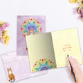 Load image into Gallery viewer, The inside of Tree-Free’s Good Vibes Cat card, with the cover and envelope in the background.
