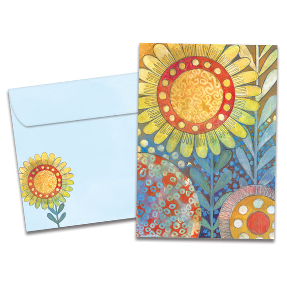 The cover of Tree-Free's Golden Glow card, along with its matching envelope.