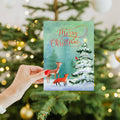 Load image into Gallery viewer, Lifestyle image(s) featuring Tree-Free’s Winter Joy card

